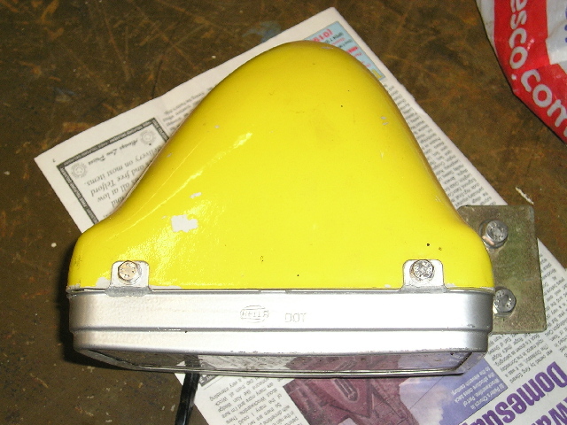 Headlight and cover above